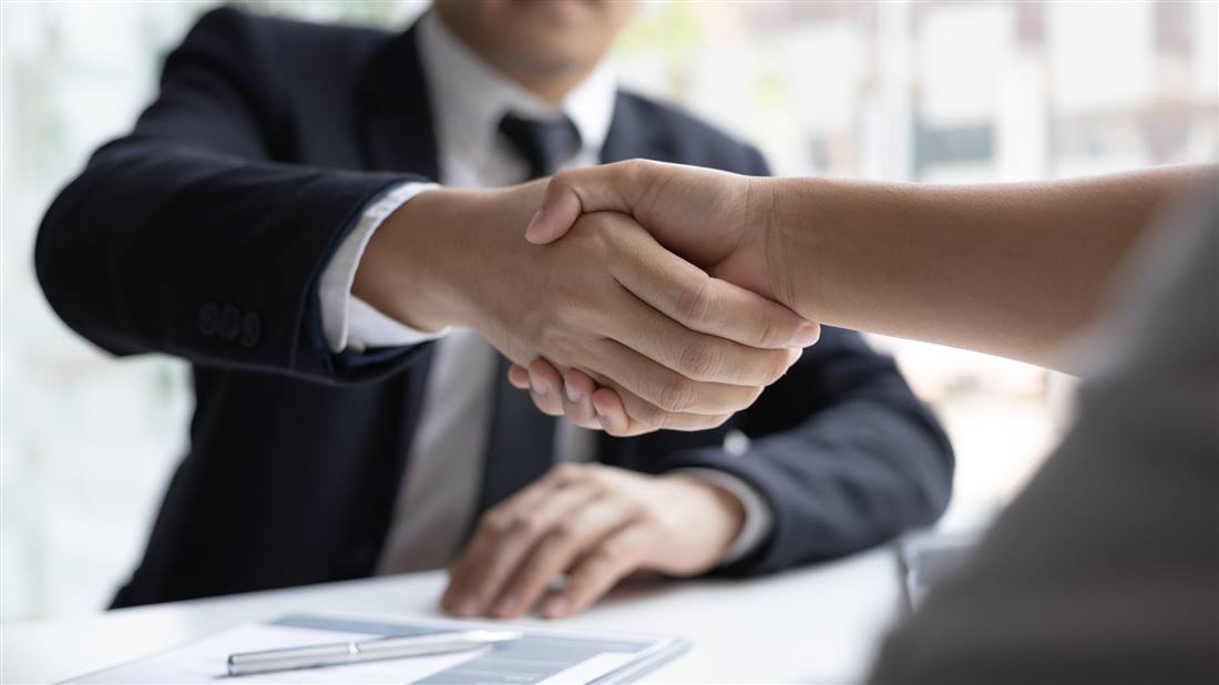 Professional handshake global recruitment agency